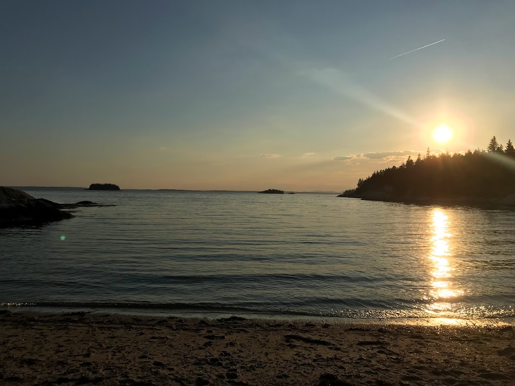 Sunset at a beach in Deer Isle, Maine in June.